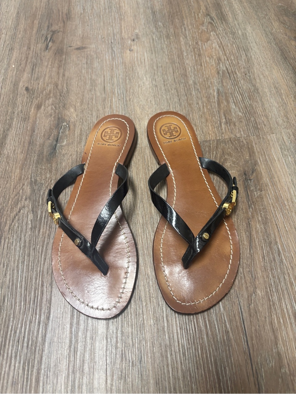 Tory Burch Black Leather Thong Sandals with Gold Logo and buckle Accent